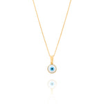 Tiny Jewels gold necklace with a blue evil eye pendant on a white background