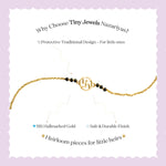 Tiny Jewels gold bracelet with black beads on a white background with promotional text about Tiny Jewels Nazariyas.