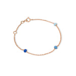 Tiny Jewels rose gold bracelet with blue beads on a white background