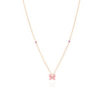 Tiny Jewels necklace with a pink butterfly pendant on a white background