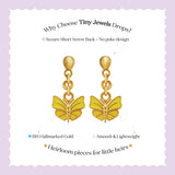 Tiny Jewels gold butterfly earrings on a white card with text about Tiny Jewels Drops.