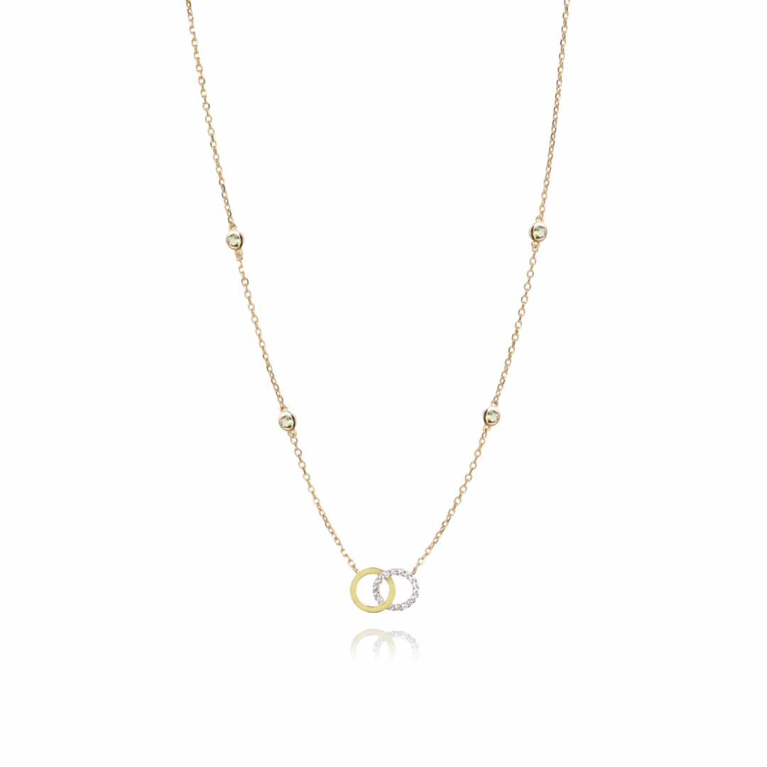 Tiny Jewels gold and silver necklace with interlocking rings on a white background