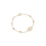 Tiny Jewels gold bracelet with interlocking rings on a white background