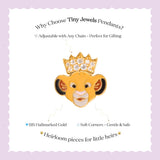 Tiny Jewels gold pendant shaped like a lion's head with a crown on a white background