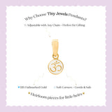 Tiny Jewels gold pendant with Om symbol on a white card with purple border