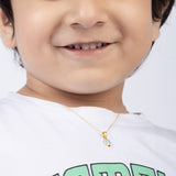 Tiny Jewels Close-up of a child wearing a gold necklace with a small pendant.