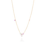 Tiny Jewels necklace with a pink bow charm on a white background