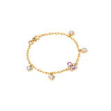Tiny Jewels gold bracelet with colorful heart-shaped charms on a white background