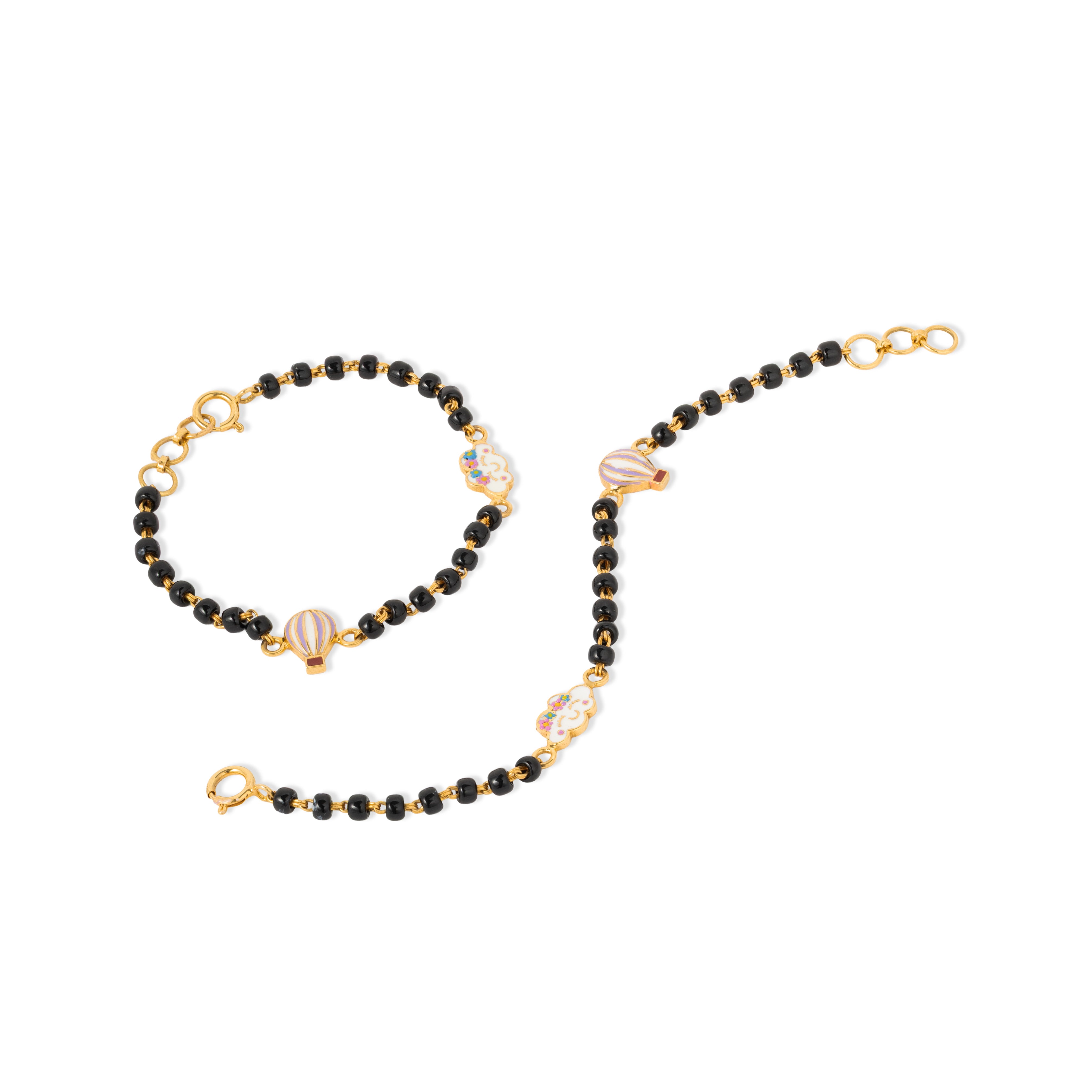 Tiny Jewels black beaded bracelet with gold accents on a white background