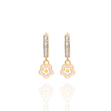 Tiny Jewels gold hoop earrings with pink flower charms on a white background