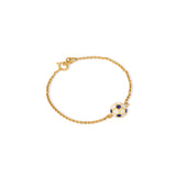 Tiny Jewels gold bracelet with a blue and white sphere charm on a white background