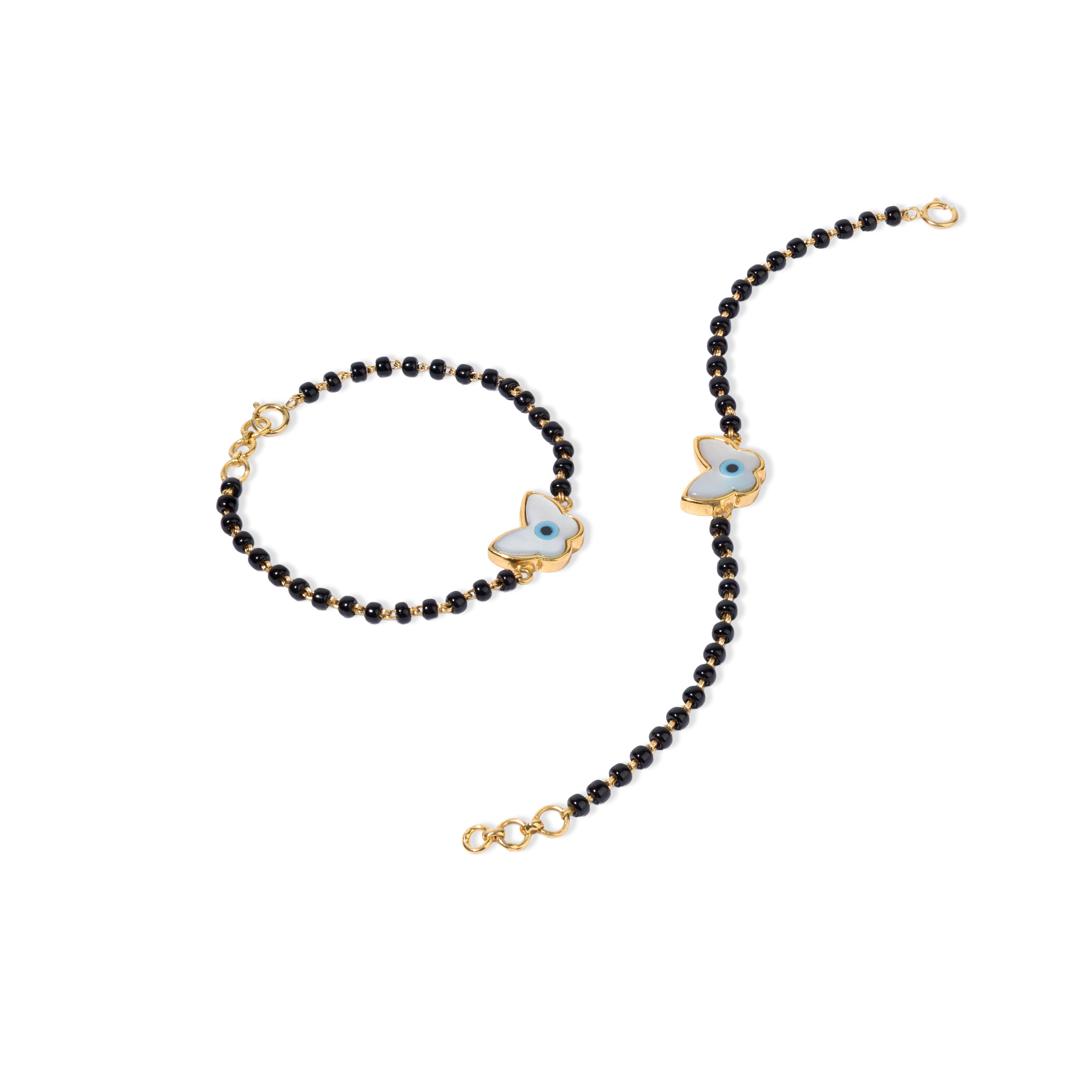 Tiny Jewels black beaded necklace with gold and blue butterfly pendants on a white background