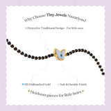 Tiny Jewels black beaded bracelet with a gold butterfly charm on a light purple background, featuring text about Tiny Jewels Nazariyas.
