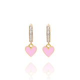Tiny Jewels gold hoop earrings with heart-shaped charms on a white background
