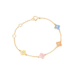 Tiny Jewels gold bracelet with colorful flower-shaped charms on a white background