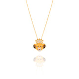 Gold necklace with a lion head pendant on a white background