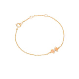 Tiny Jewels gold bracelet with a small bow-shaped clasp on a white background