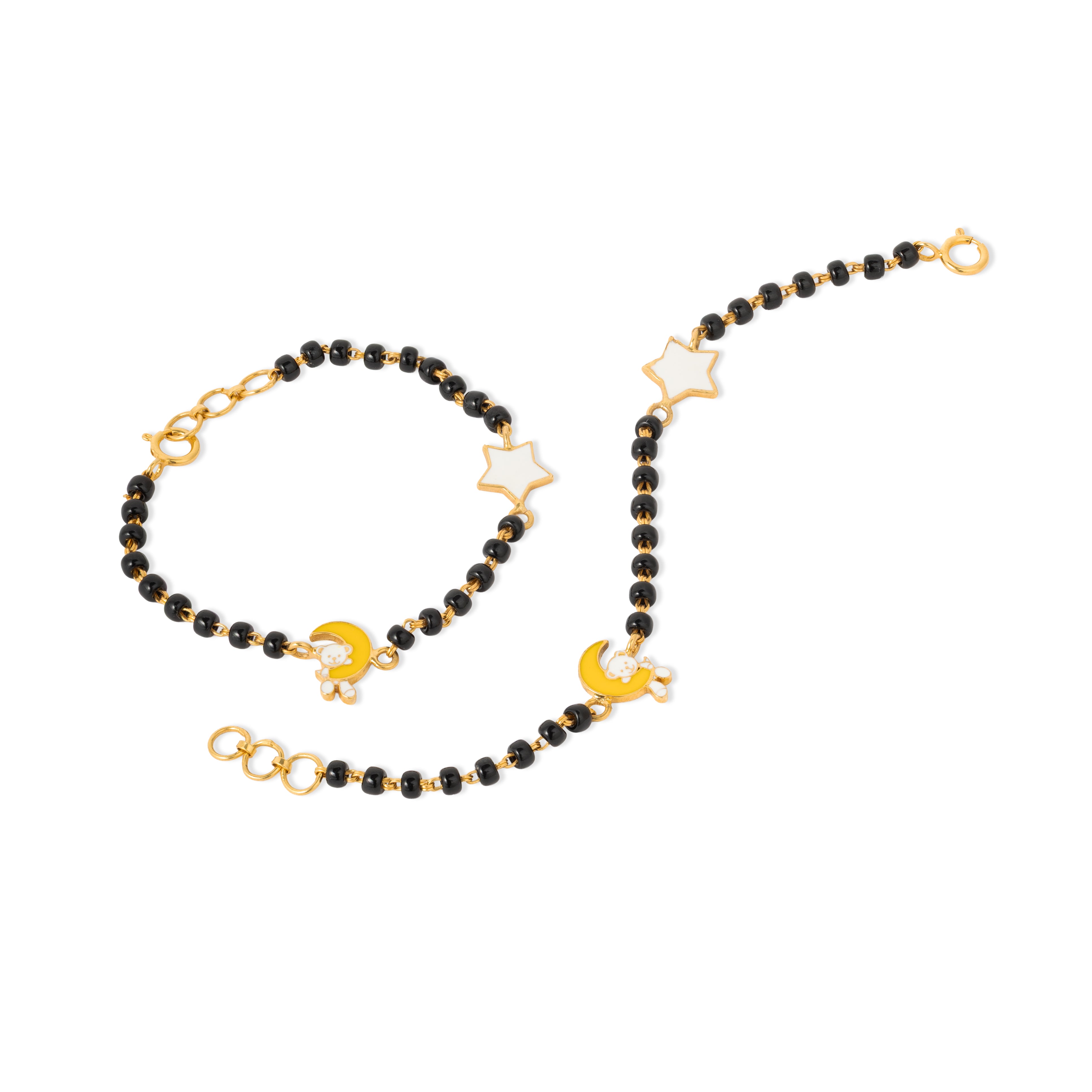 Tiny Jewels black beaded bracelet with gold moon and star charms on a white background