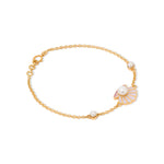 Tiny Jewels gold bracelet with decorative elements on a white background