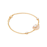 Tiny Jewels gold bracelet with decorative elements on a white background
