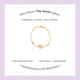 Tiny Jewels gold bracelet with a heart design on a light purple background, featuring text about Tiny Jewels Kadas.