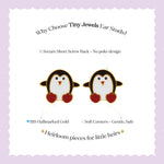 Tiny Jewels penguin-shaped earrings with red hearts on a white background with text about Tiny Jewels ear studs.