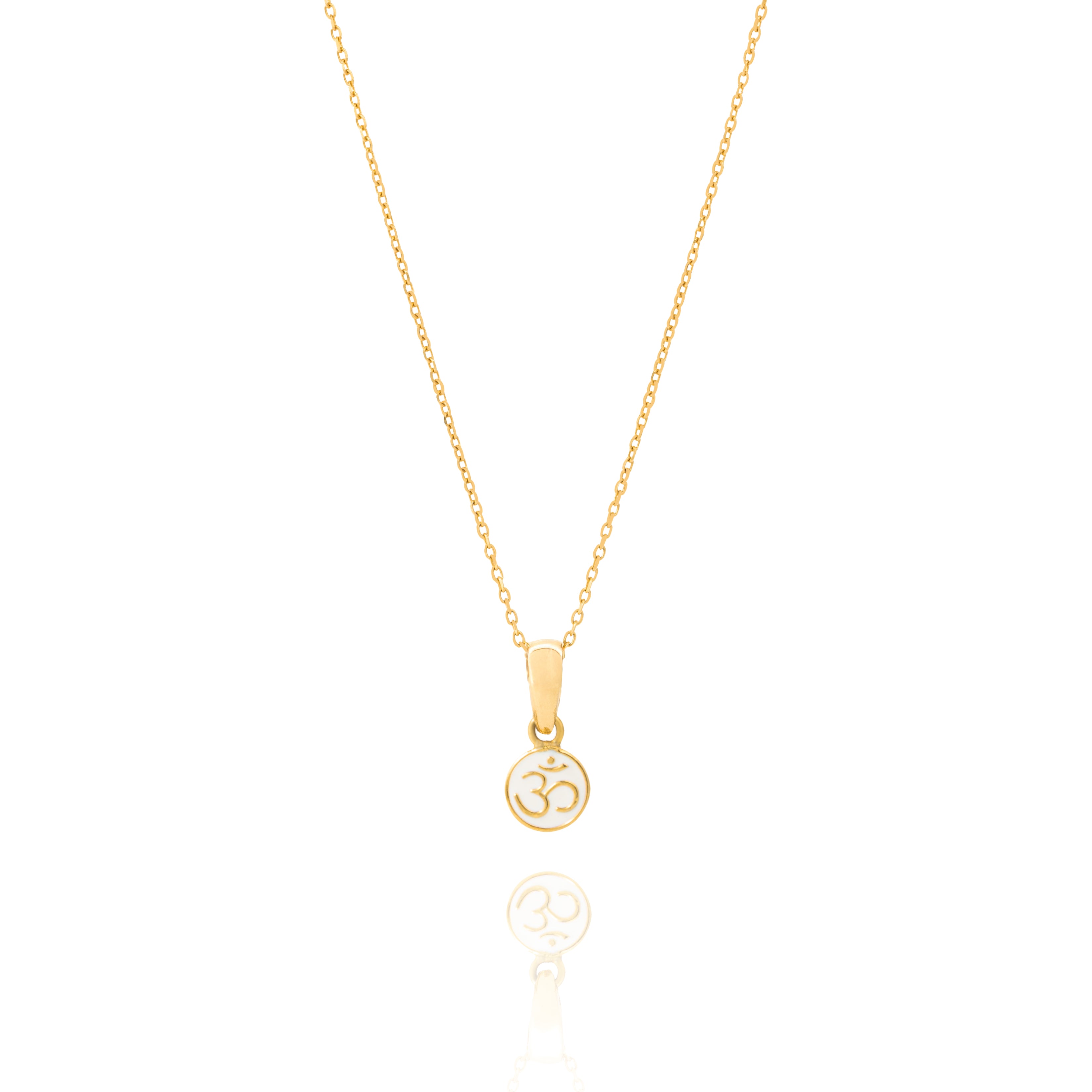 Tiny Jewels gold pendant with Om symbol on a white background
