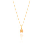 Tiny Jewels gold pendant with a pink flower design on a white background