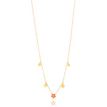 Tiny Jewels gold necklace with yellow beads on a white background