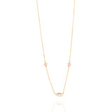 Tiny Jewels gold necklace with small colorful stones on a white background