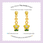 Tiny Jewels gold earrings with green bases on a white background with text about 'Tiny Jewels'.