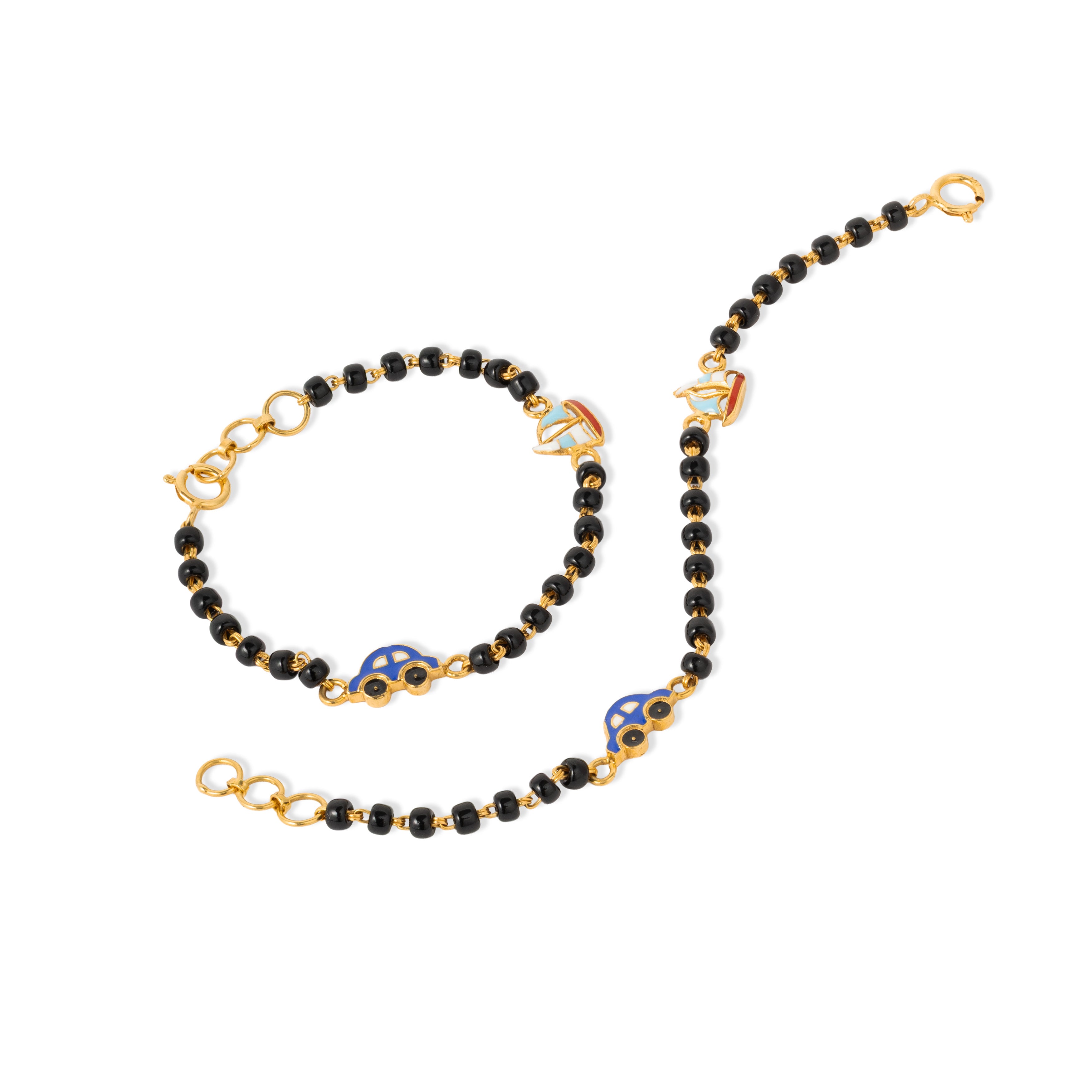 Tiny Jewels black beaded necklace with gold accents on a white background